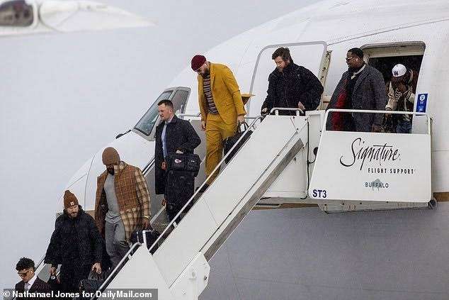 Exclusive: Travis Kelce and the Chiefs arrived in snowy Buffalo for Sunday's HUGE NFL showdown vs. the Bills, with his girlfriend Taylor Swift set to cheer from the stands after'stalker' 'was' arrested outside her Manhattan apartment.