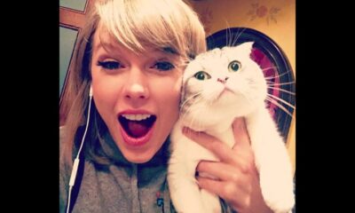Taylor Swift responds to a fan who criticized her for frequently kissing and being seen with her cat, stating, “I can’t be without my cat, Travis,” emphasizing the importance of her feline companion in her life.